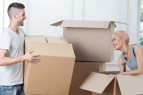 Worker using safe lifting techniques during a move